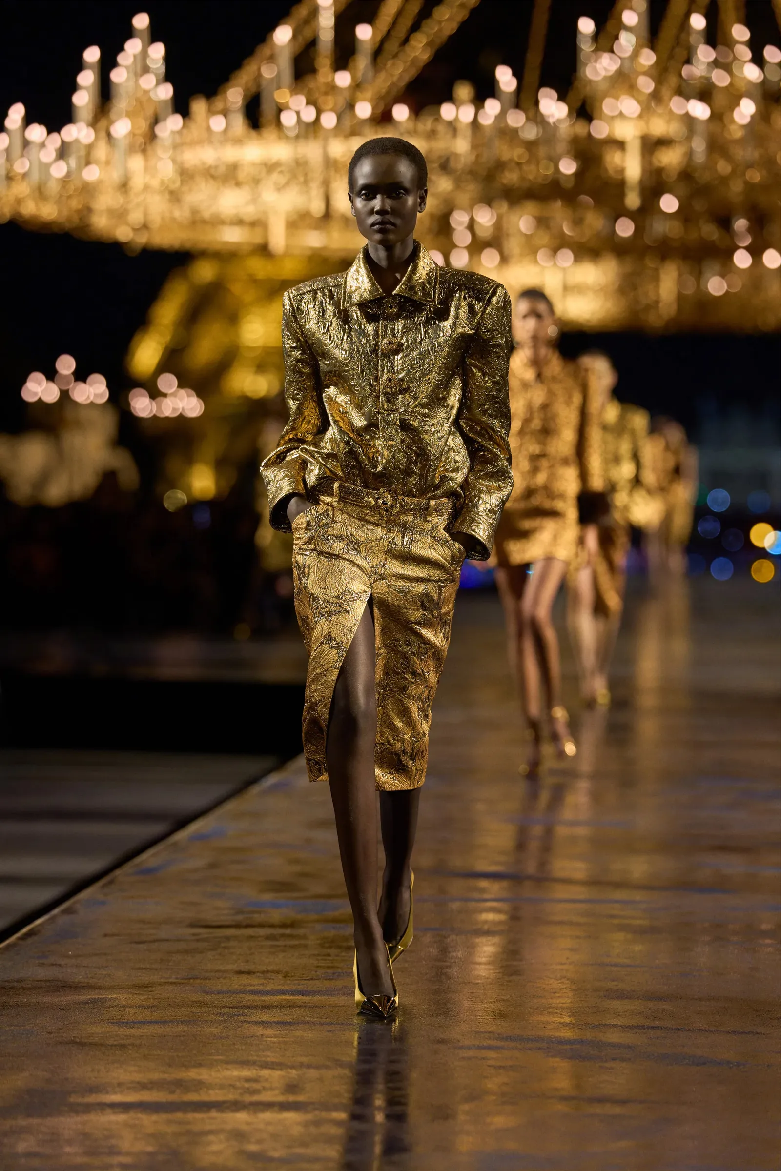 Image may contain Vivian Cheruiyot Person Lighting Adult Fashion Runway Clothing Coat and Performer