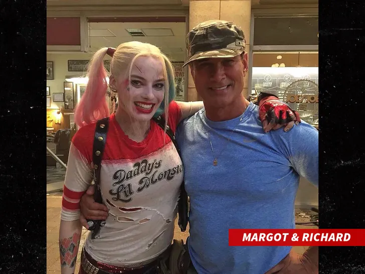 Richard Norton and Margot Robbie