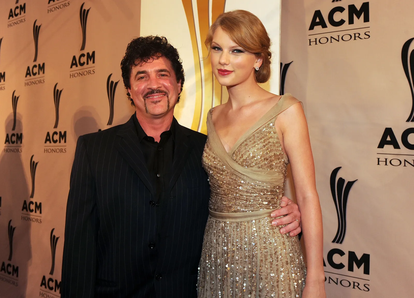 Image may contain Scott Borchetta Taylor Swift Fashion Clothing Dress Adult Person Wedding Formal Wear and Blazer
