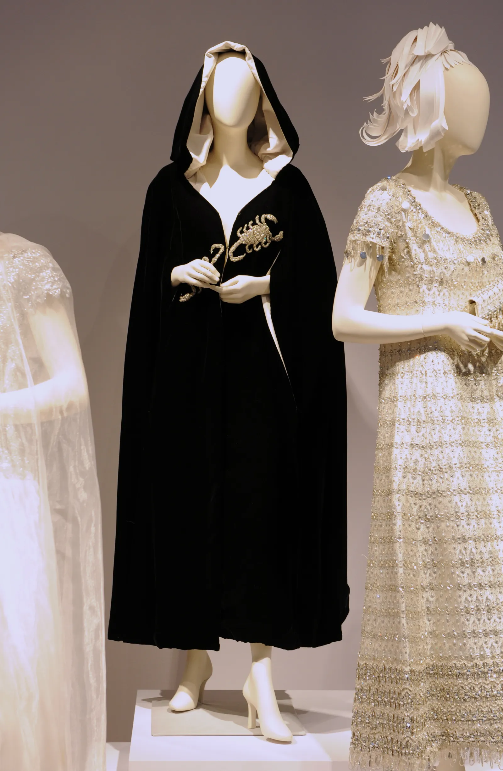 A Tiziani black velvet Scorpio evening cape  worn to Princess Grace of Monaco's 40th birthday Scorpio ball and a...