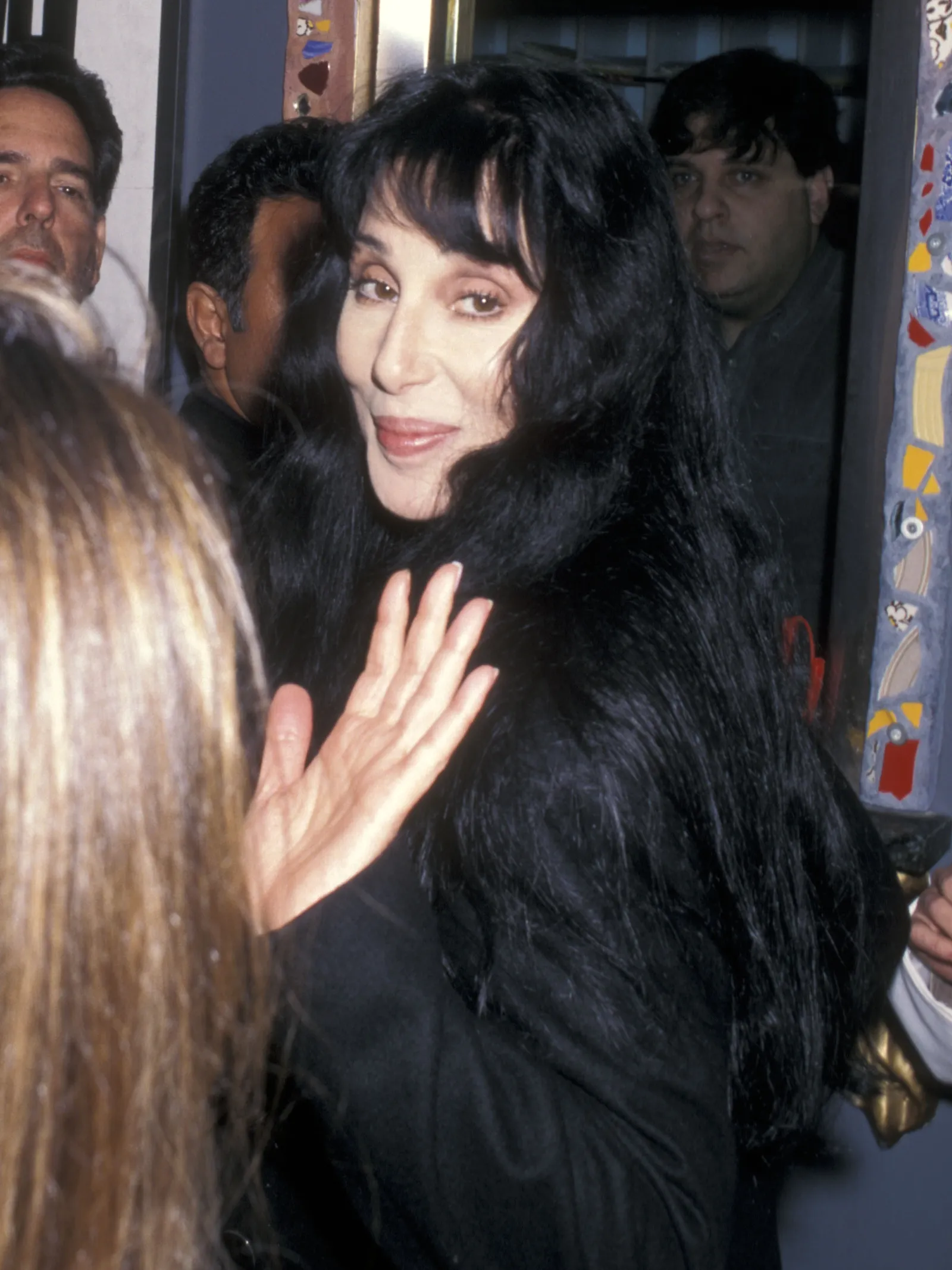 Image may contain Cher Cher Black Hair Hair Person Adult Photobombing Face Head Photography and Portrait