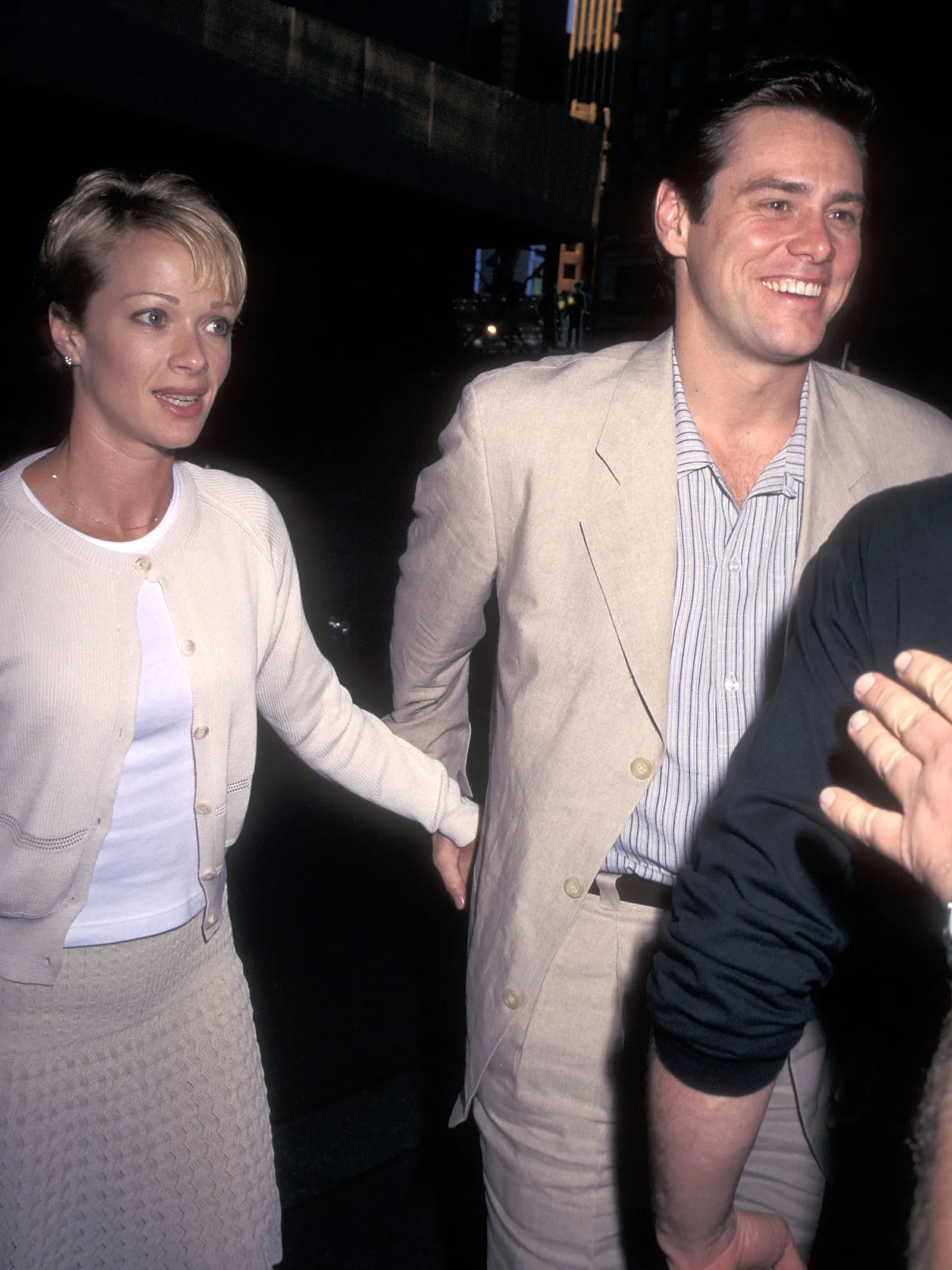 Image may contain Jim Carrey Lauren Holly Blazer Clothing Coat Jacket Formal Wear Suit Adult and Person