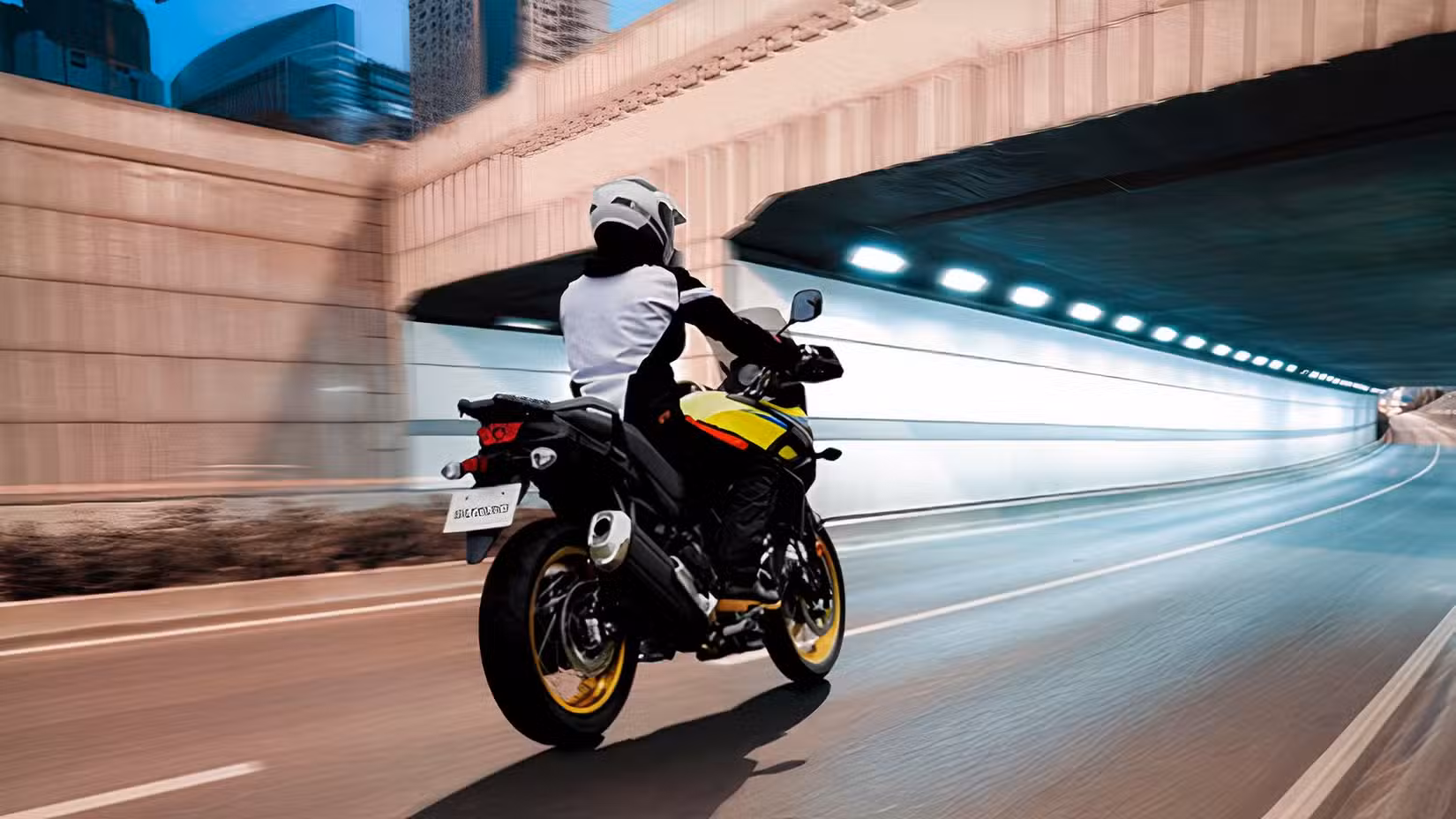 Rear shot of a Suzuki V-Strom 650 XT cruising on highway