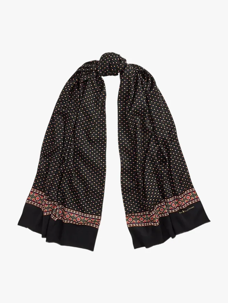 Image may contain: Clothing, Scarf, Stole, Skirt, and Coat