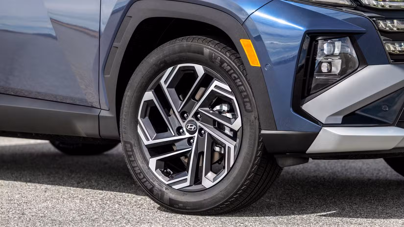 2026 Hyundai Tucson Hybrid Hyundai SUV front wheel and tire close-up.