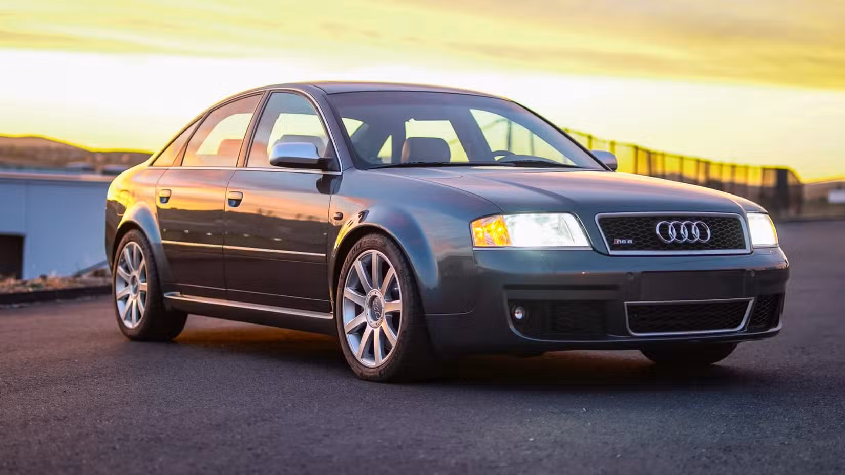 The front 3/4 view of a grey 2003 Audi RS6 Sedan parked