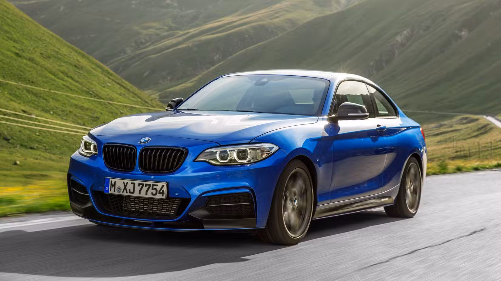 2015 BMW M235i Coupe front 3/4 exterior action shot