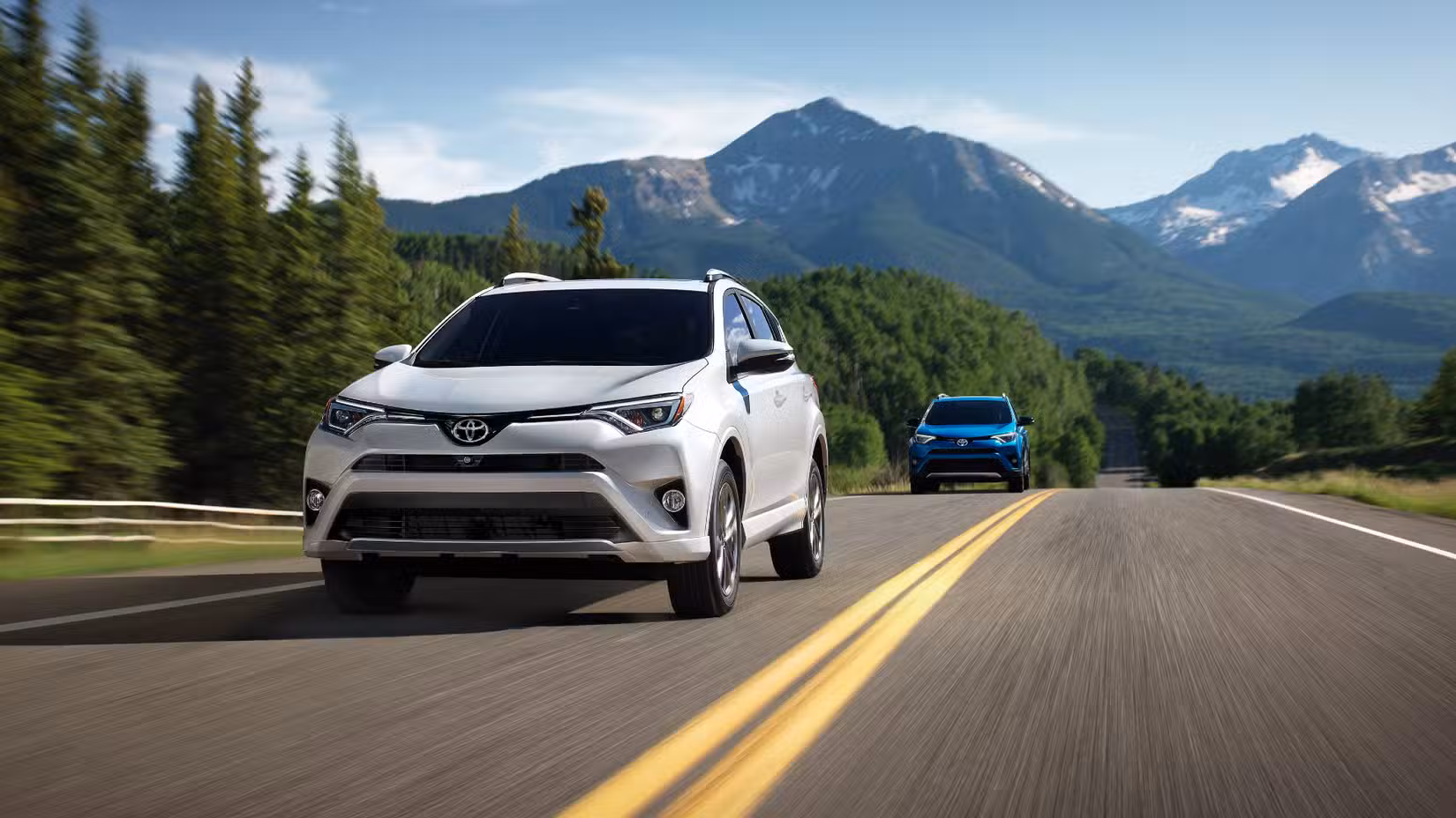 2018 Toyota RAV4 Hybrid SE Driving Down Road