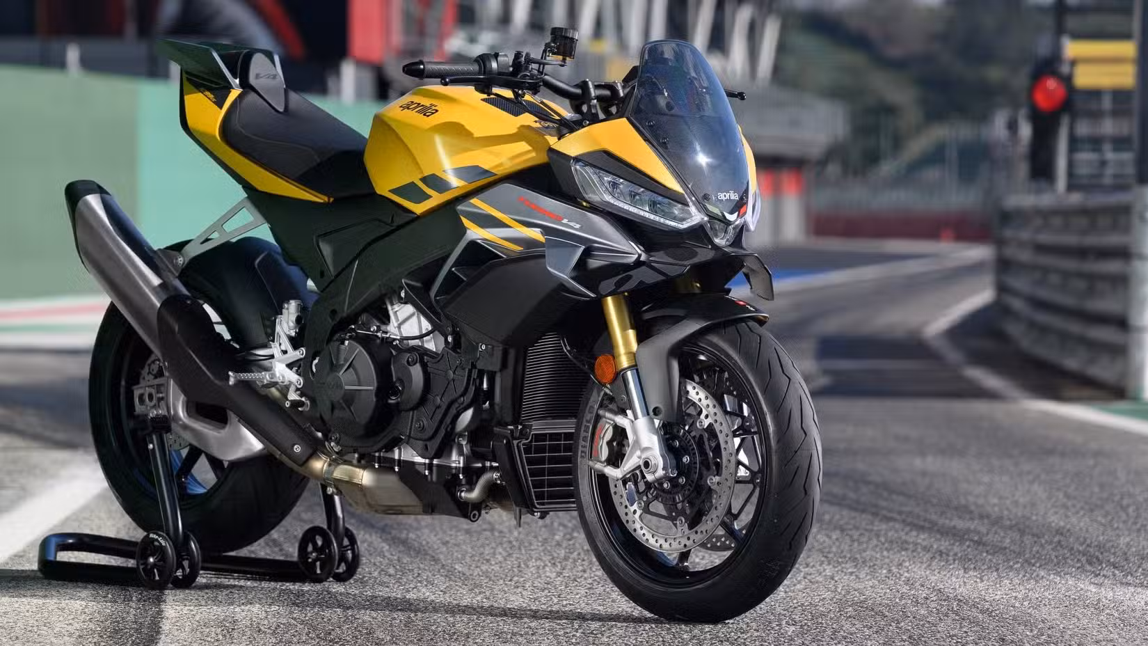 2026 Aprilia Tuono V4 1100 on a paddock stand on a racetrack