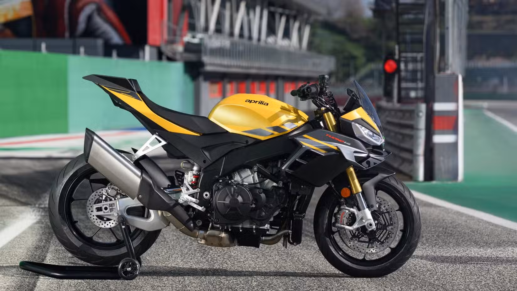 Side Profile Image Of A Yellow 2025 Aprilia Tuono V4