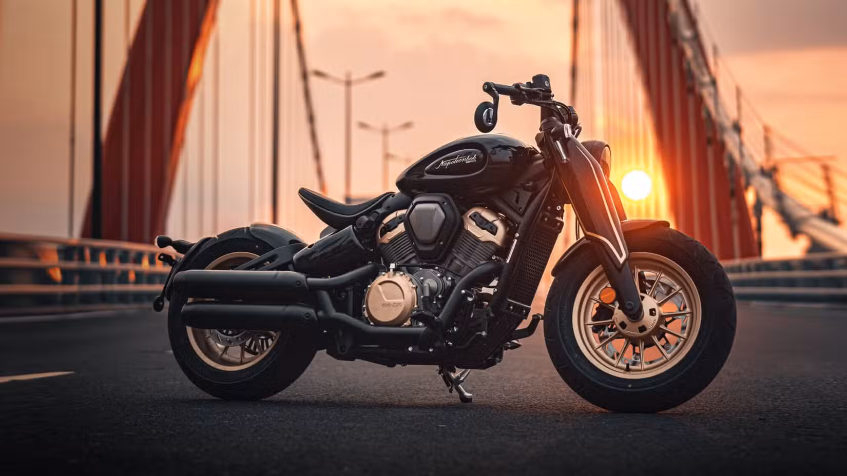 2025 Benda Napoleon Bob 500 parked on a bridge with the sun setting in the background
