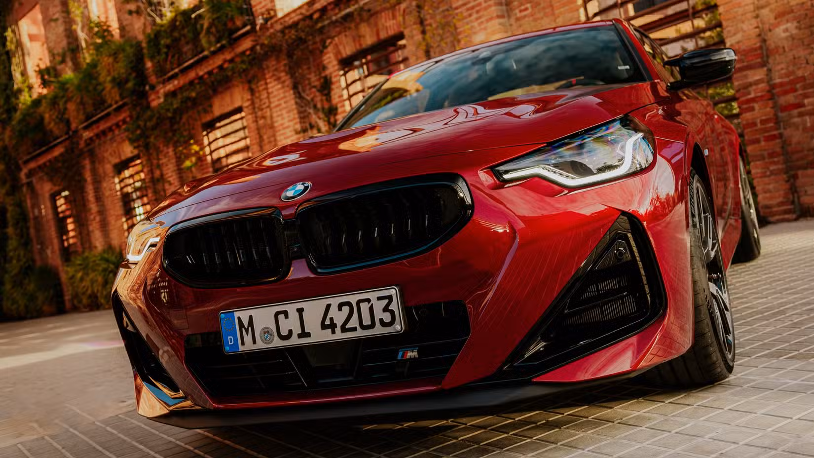 2025 BMW M240i xDrive front 3:4th low angle shot