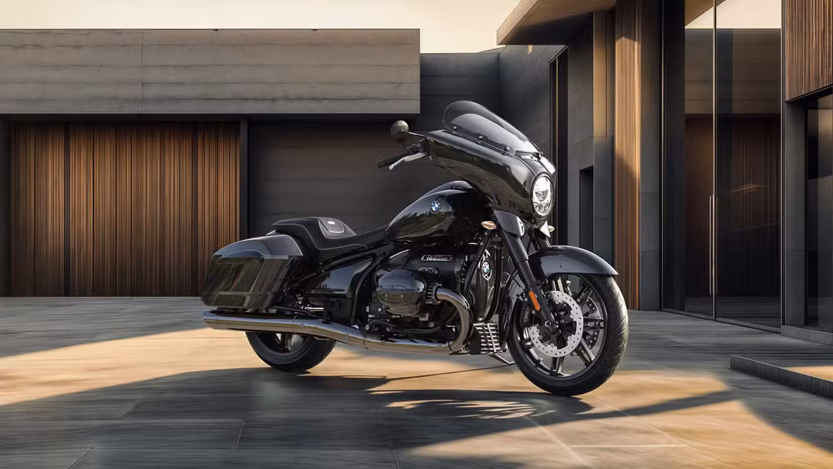A black 2025 BMW R 18 B parked Infront of building outdoors. 