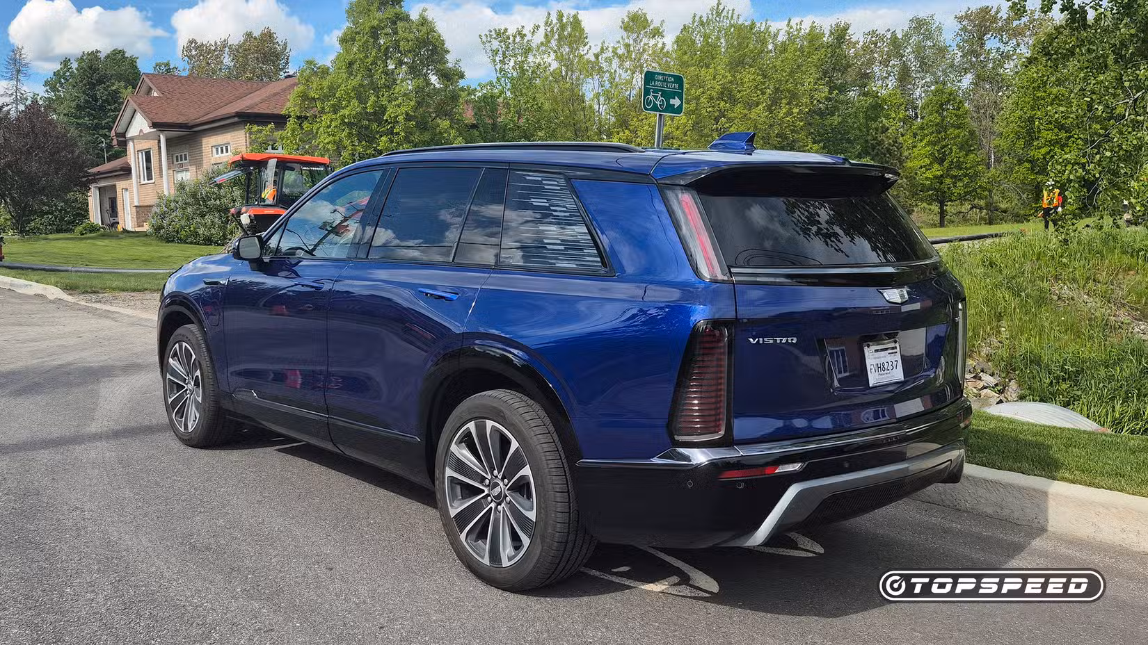 2025 Cadillac Vistiq rear 3/4 shot parked on the road