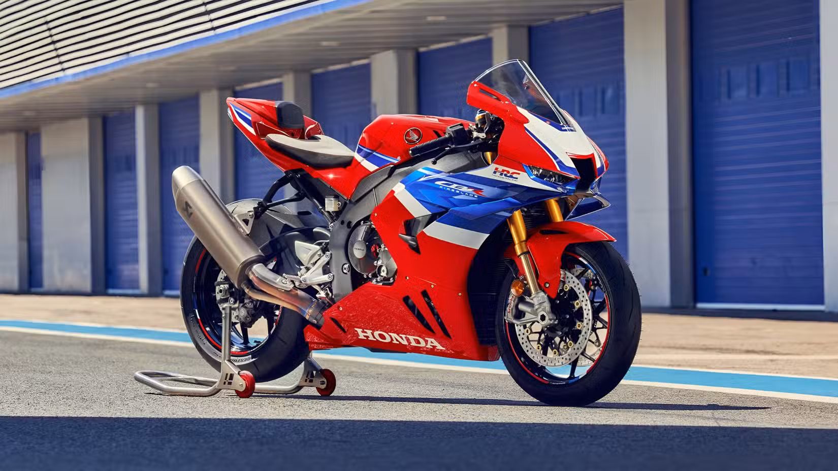 A red and white 2025 Honda CBR1000RR-R Fireblade SP parked at the pits