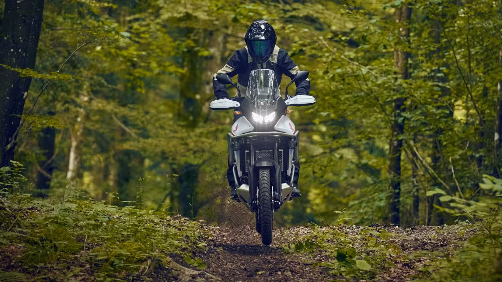 2026 Honda Transalp taking flight on an off-road run cinematic front fascia shot