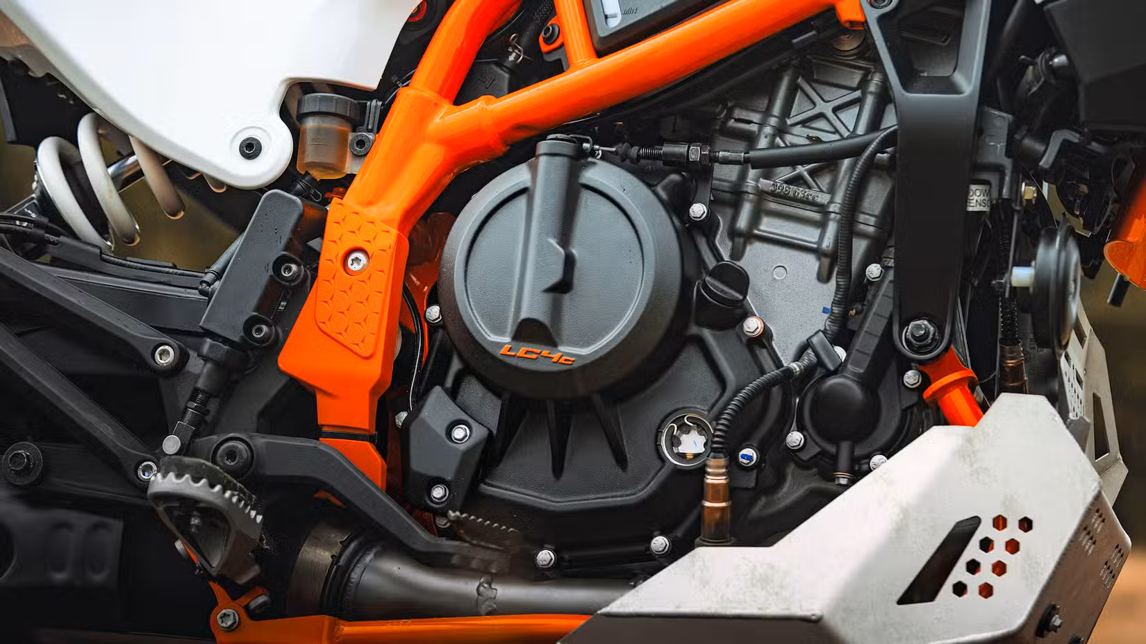 Close-up detail shot of a 2026 KTM 390 Adventure R engine