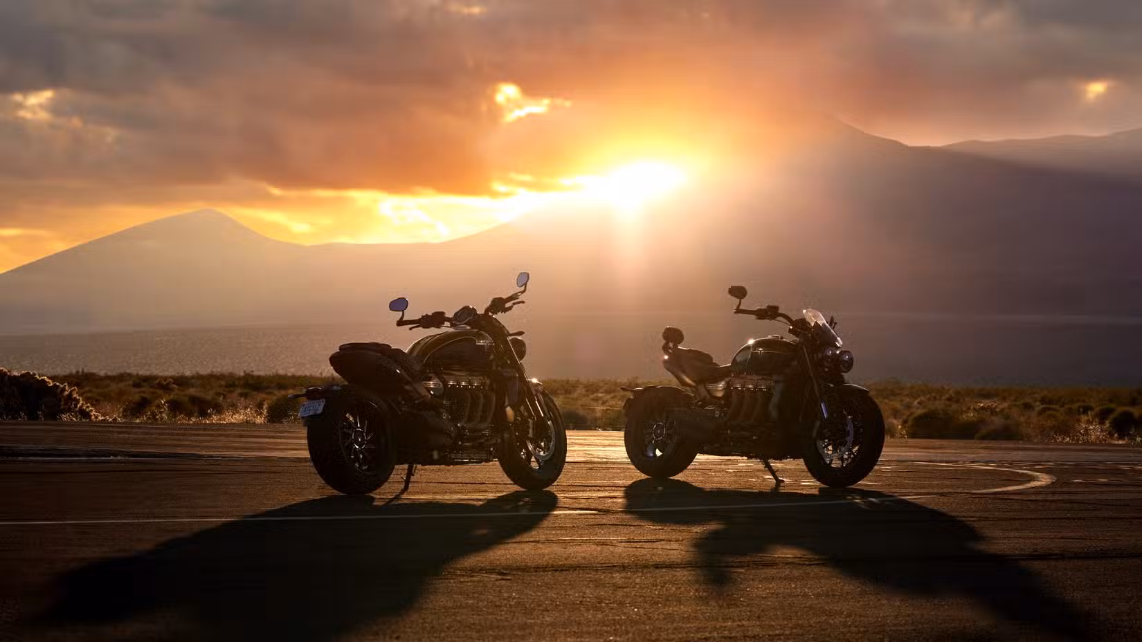 2025 Triumph Rocket 3 Storm R And GT Parked in front of mountains
