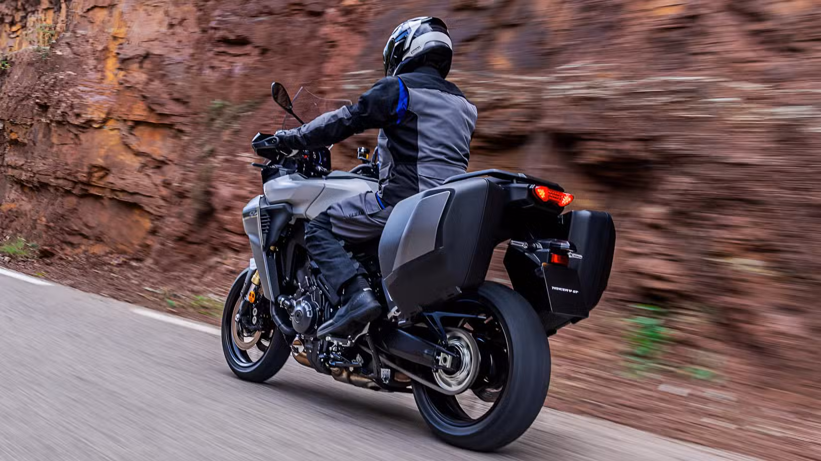 2026 Yamaha Tracer 9 on the road rear third quarter rolling shot