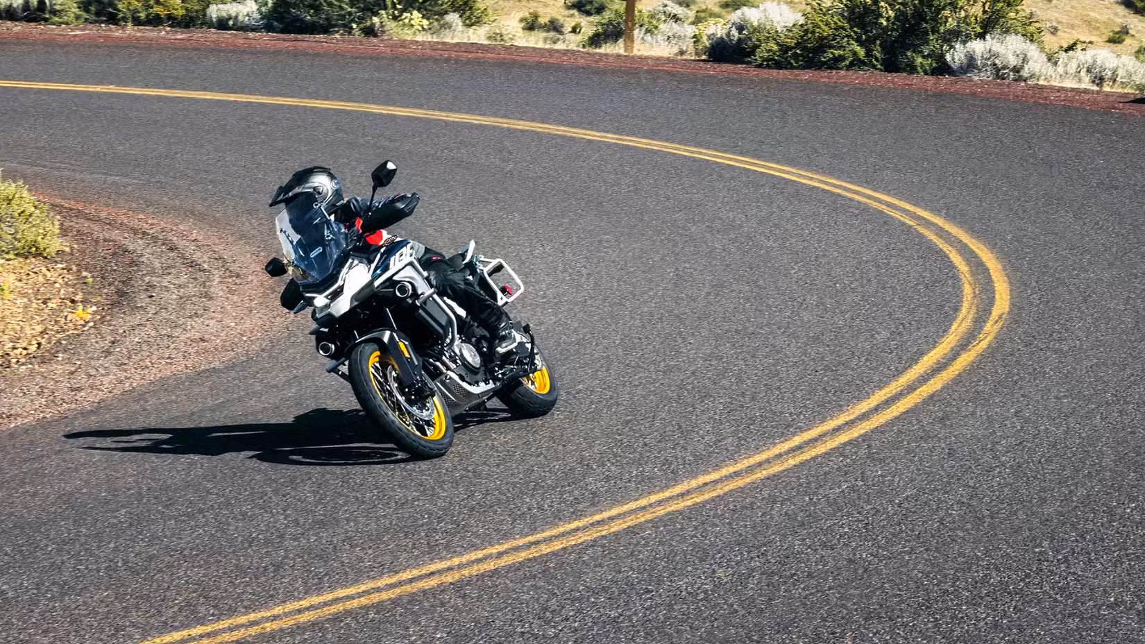 2026 CFMoto Ibex 800 E taking a right turn on the highway