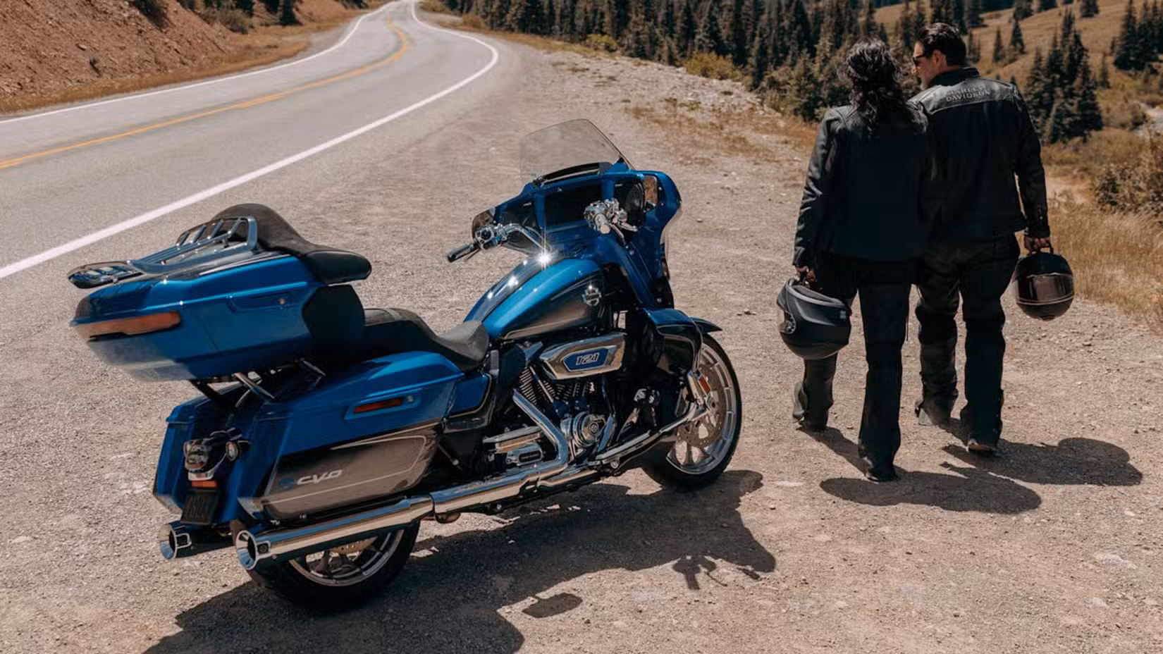 2026 Harley-Davidson CVO Street Glide Limited parked at the side of the road with riders next to it
