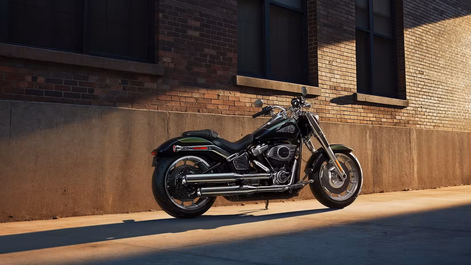 Black 2026 Harley-Davidson Fat Boy parked under an overpass