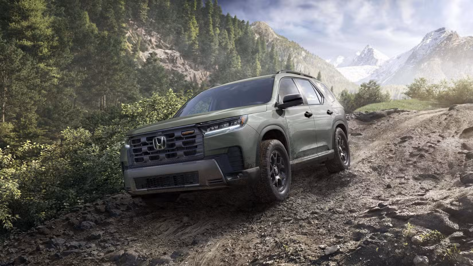 Front 3/4 action shot of 2026 Honda Pilot driving off-road