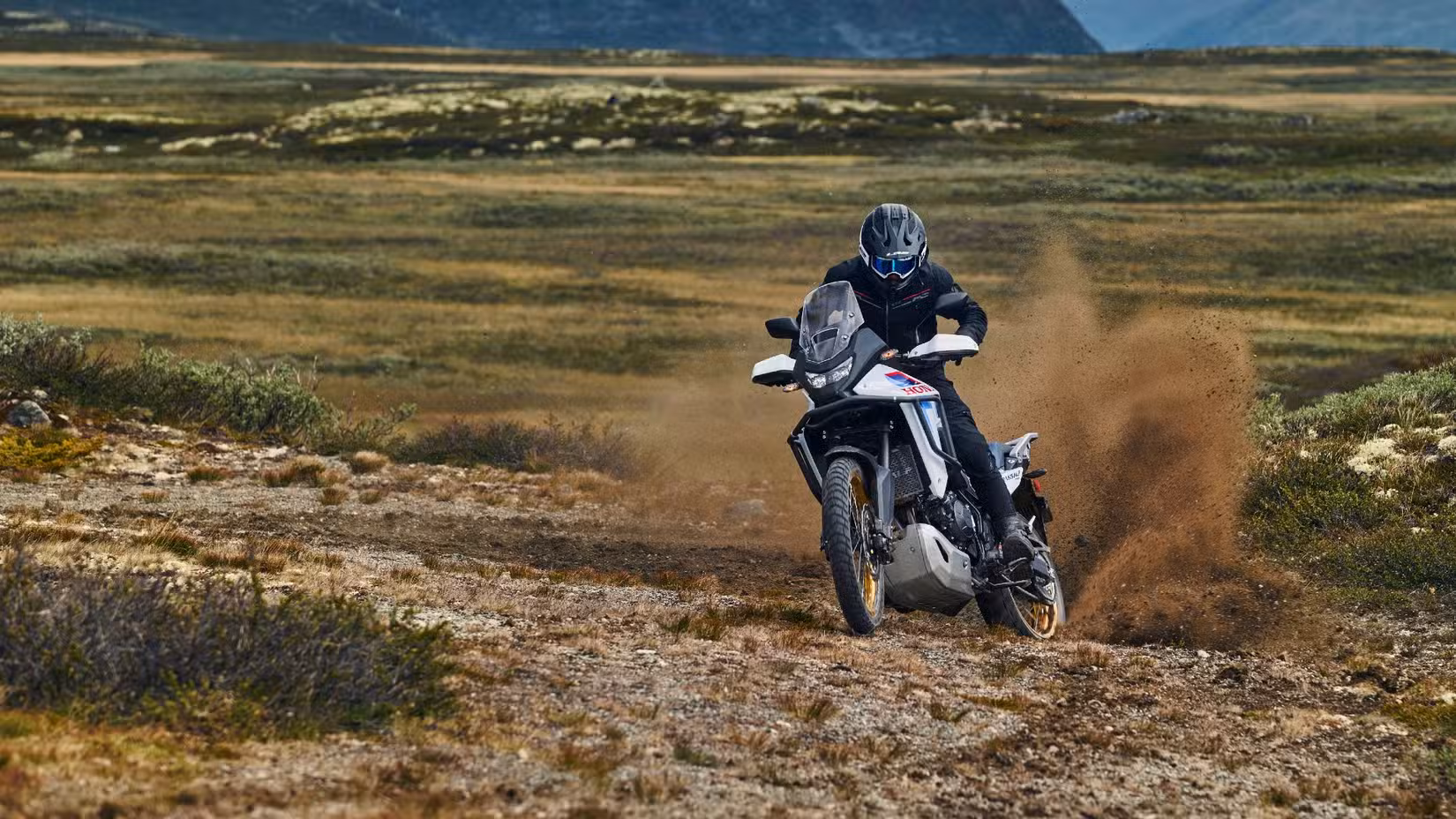 Front shot of a 2026 Honda Transalp E-Clutch Sliding In The Dirt