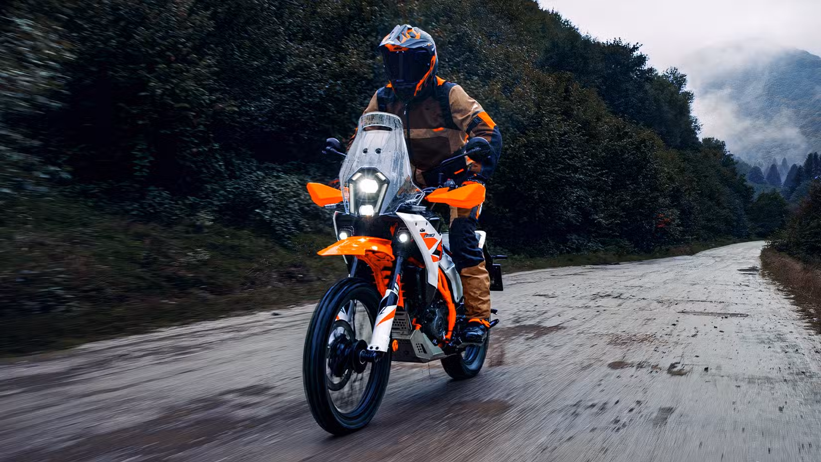 2026 KTM 390 Adventure R rider standing tall while cruising effortlessly on the tarmac