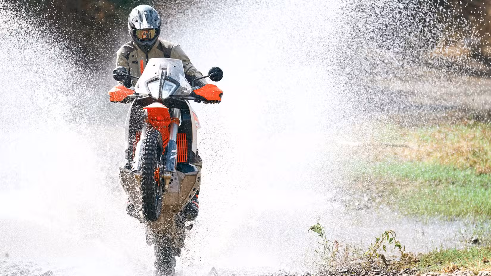 2026 KTM 890 Adventure R Doing A Wheelie Through A Water Crossing