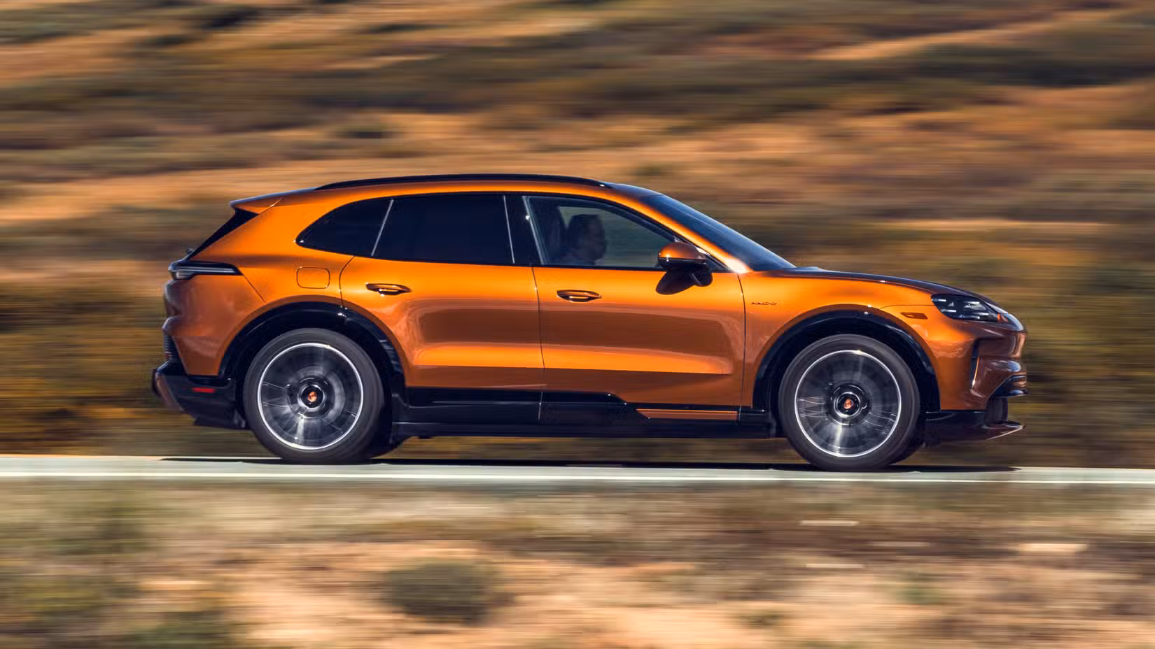 2026 Porsche Cayenne Turbo Electric side shot driving on the road