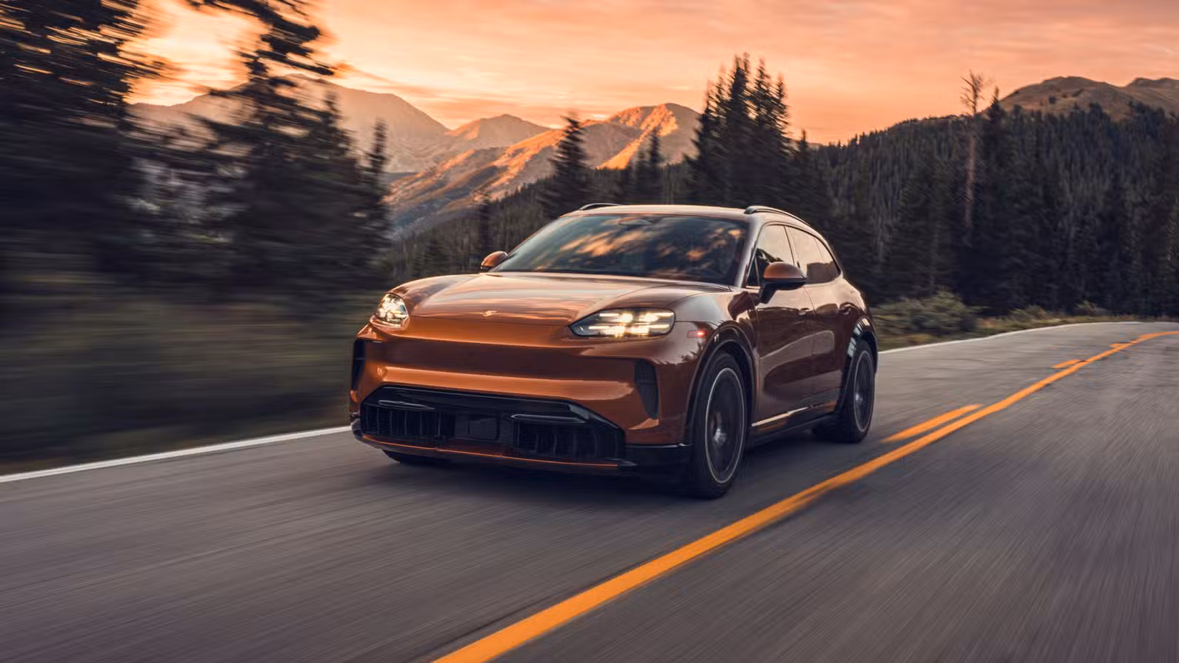 2026 Porsche Cayenne Turbo Electric front shot driving on the road