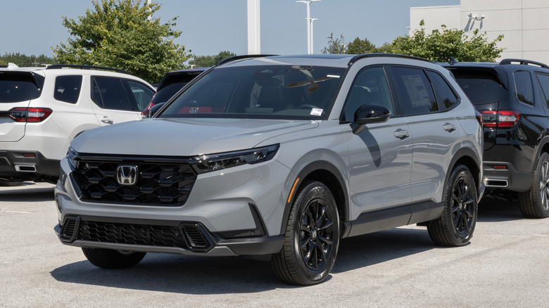 A grey Honda CR-V in a parking lot