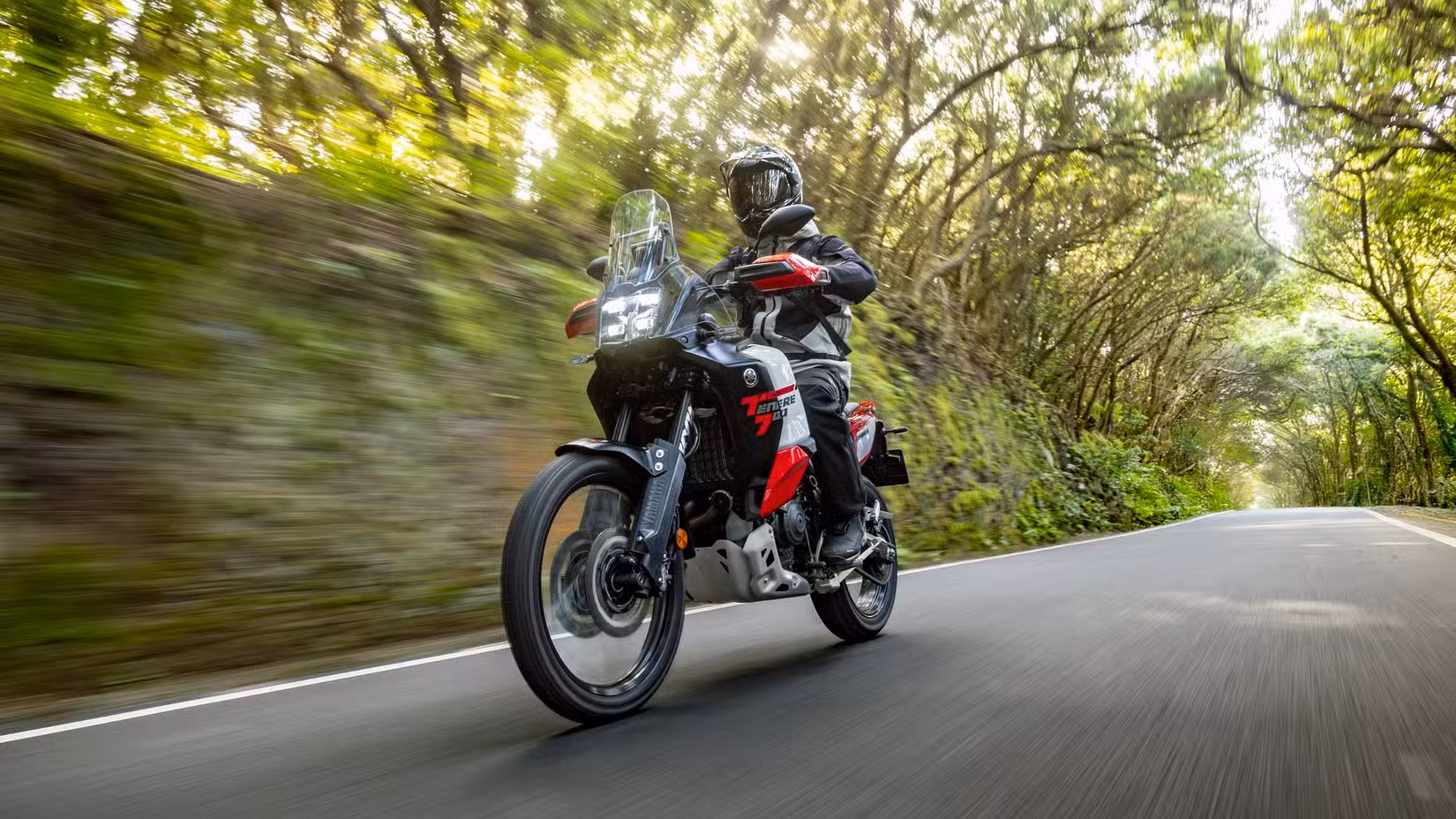 2026 Yamaha Ténéré 700 World Raid cruising on the highway front third quarter accelerating view