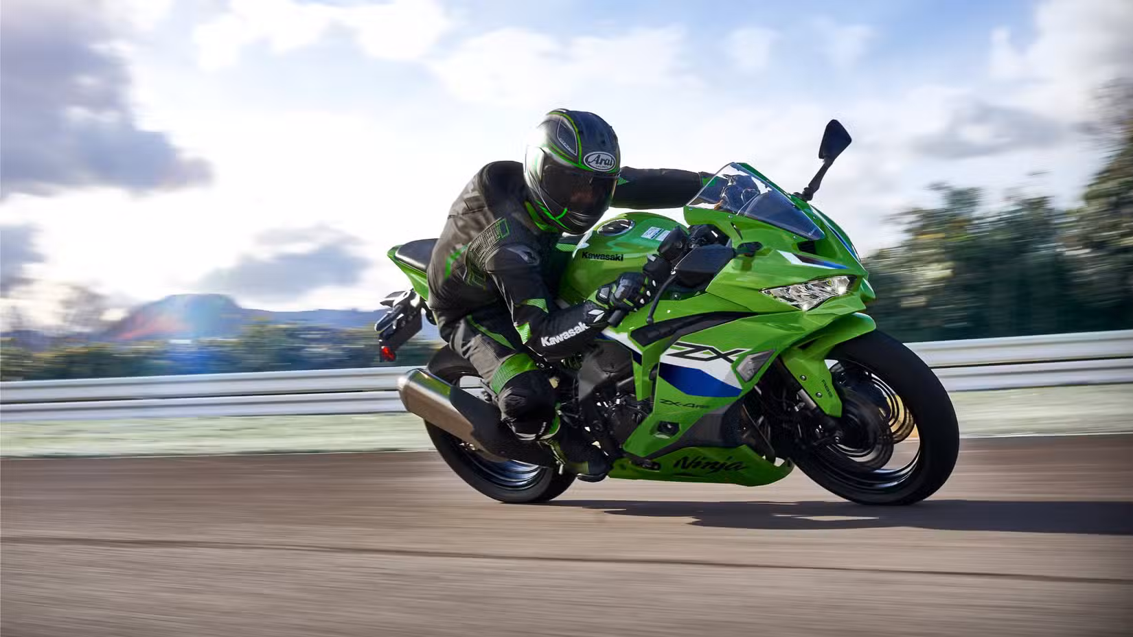 An action shot of the 2027 Kawasaki Ninja ZX-4RR on a track
