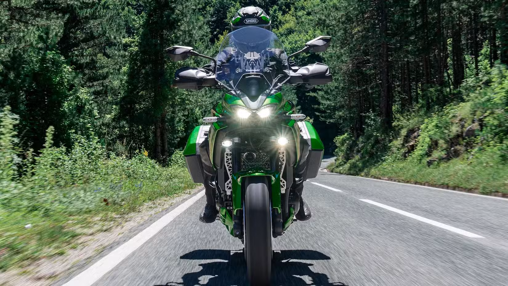 2027 Kawasaki Versys 900 SE LT Front Panning Shot In The Woods