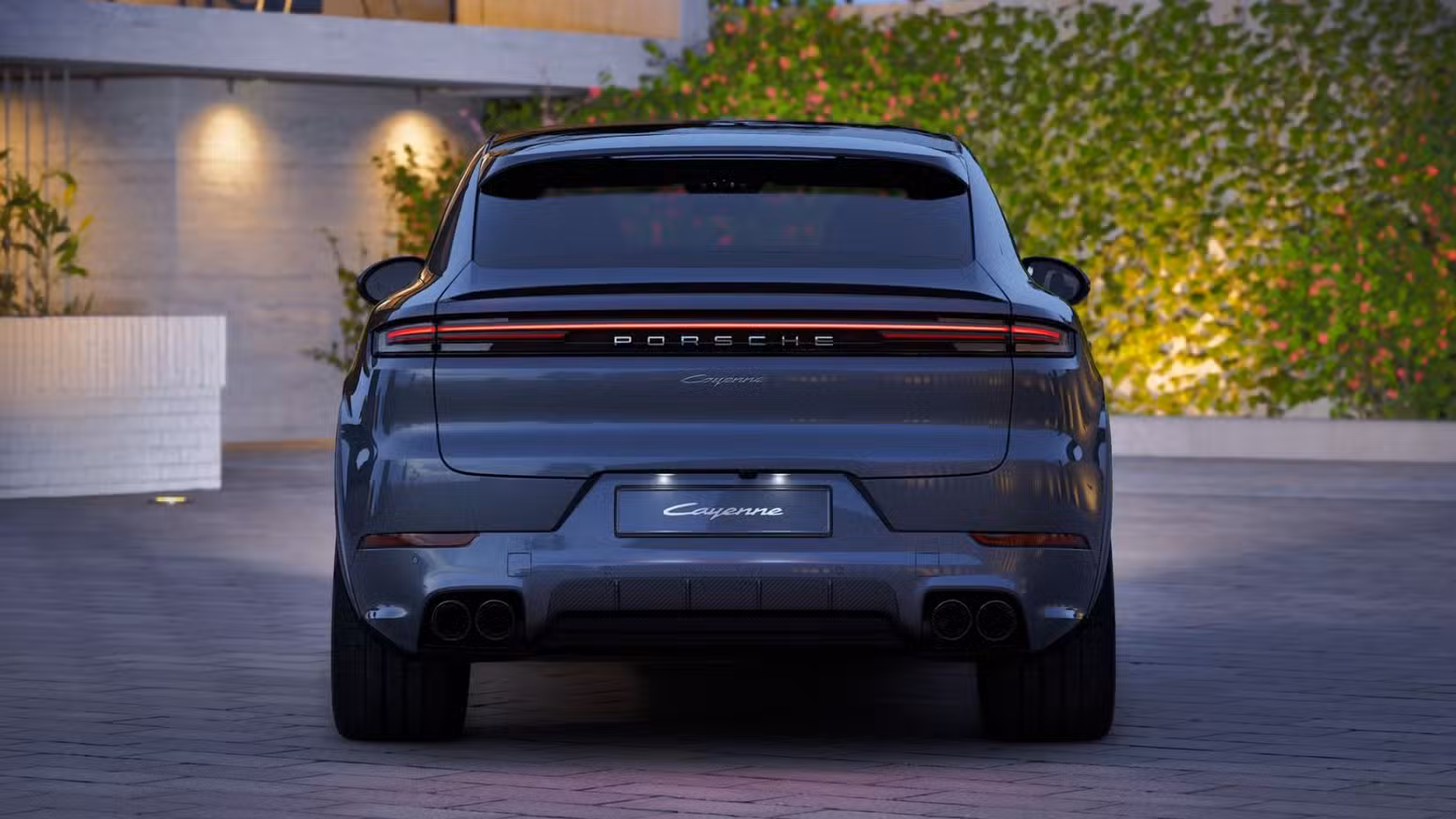 The rear end view of a grey 2027 Porsche Cayenne Coupe.