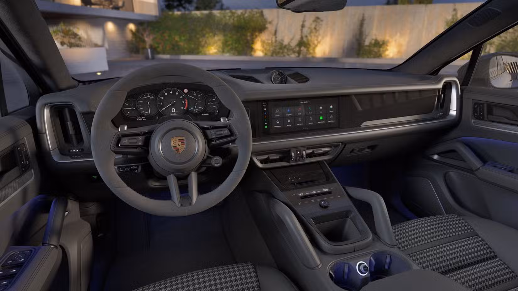 The front dashboard view of a grey 2027 Porsche Cayenne Coupe.