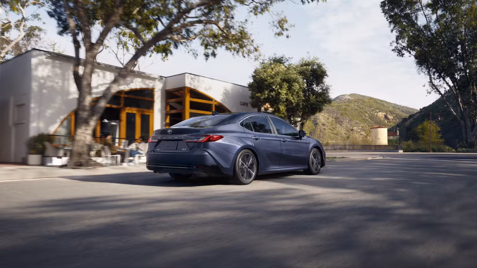2027 Toyota Camry rear 3/4 shot driving