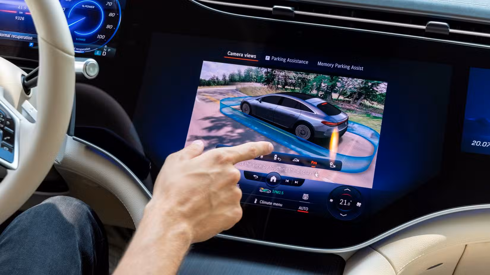 A close-up shot of the Mercedes-Benz EQS Hyperscreen being used.