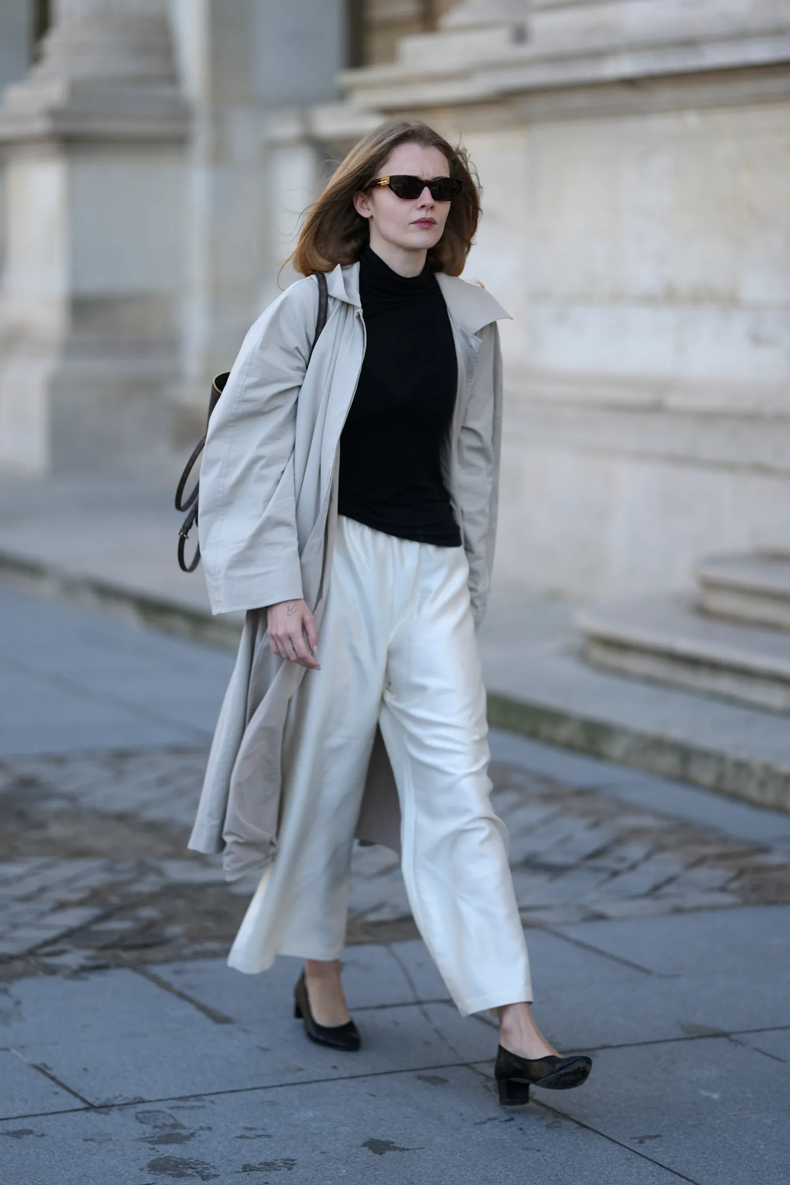 PARIS FRANCE  MARCH 10 A person is seen wearing dark brown cateye sunglasses a black turtleneck top a light gray...