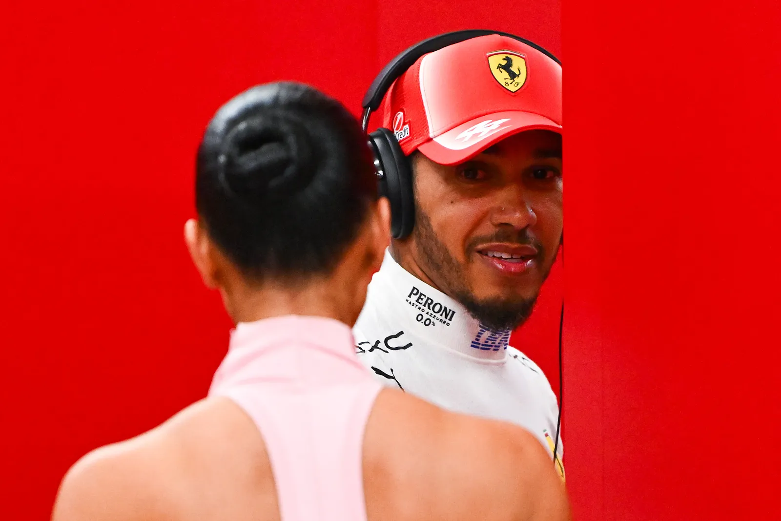 SINGAPORE SINGAPORE  OCTOBER 10 Lewis Hamilton of Great Britain and Scuderia Ferrari and Kim Kardashian in the garage...