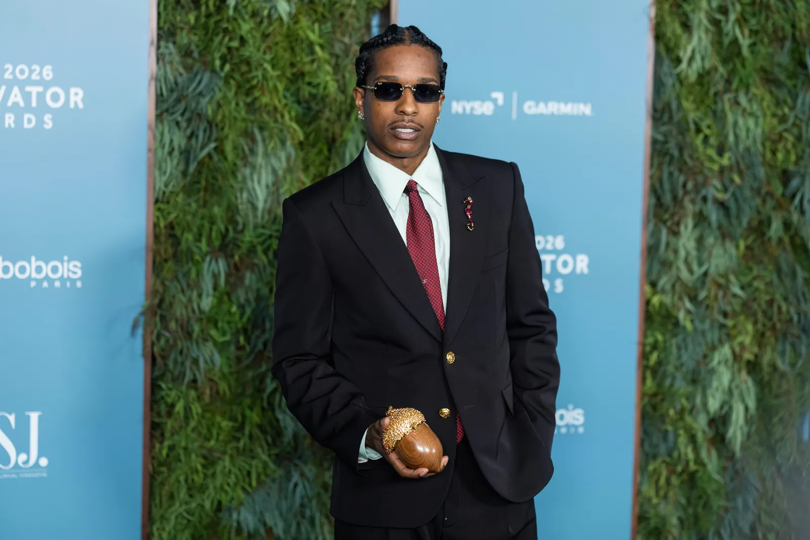 Image may contain AAP Rocky Blazer Clothing Coat Jacket Accessories Formal Wear Tie Suit Adult Person and Food