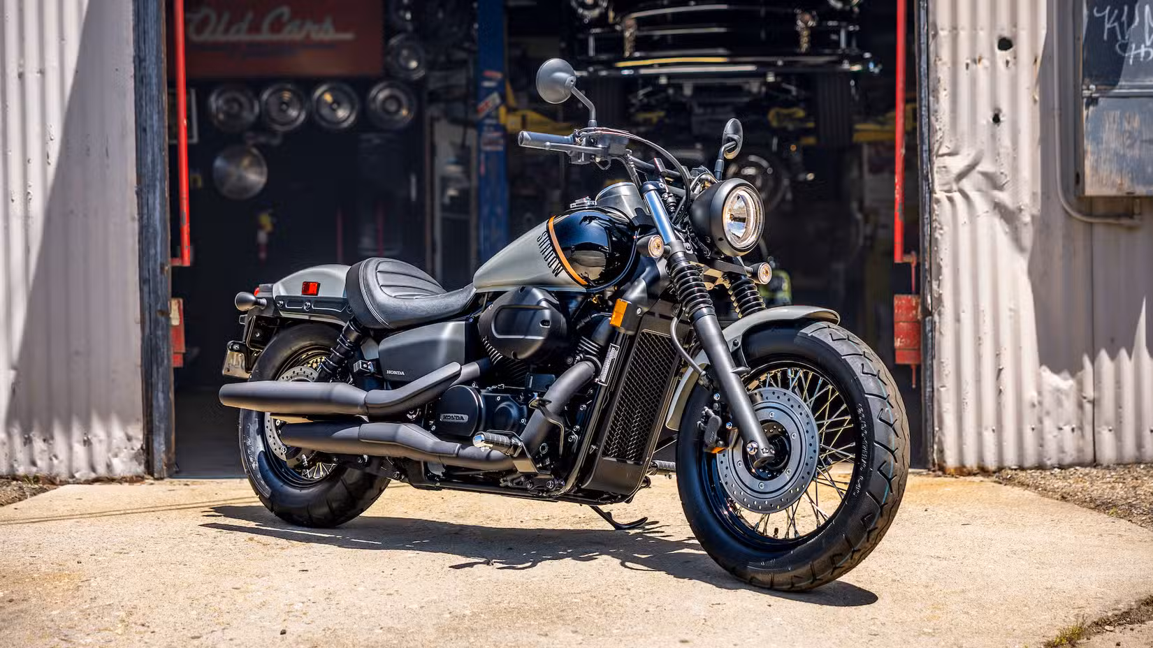 Honda Shadow Phantom parked outside a workshop