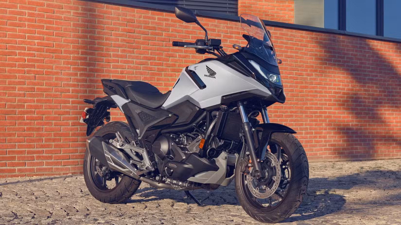 White Honda NC750X parked on the street