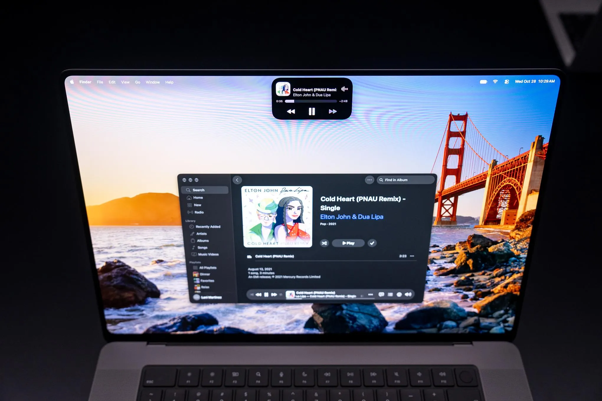 Shot of the Dynamic Island on the MacBook Pro with PROLED XDR showing currently playing song.