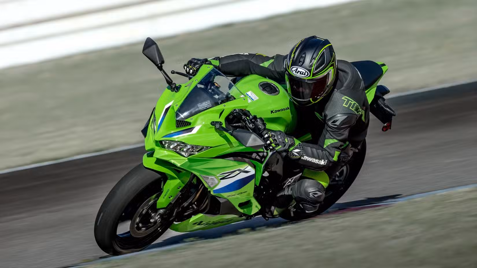 Action shot of a Kawasaki Ninja ZX-4RR cornering on a racetrack