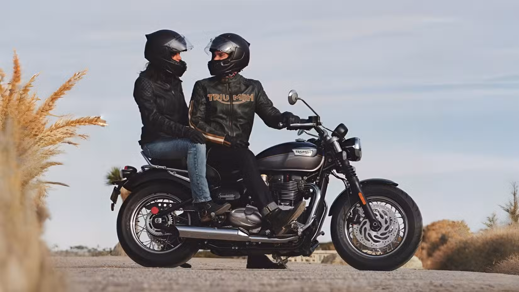 2026 Triumph Bonneville Speedmaster on a touring run with rider and pillion atop