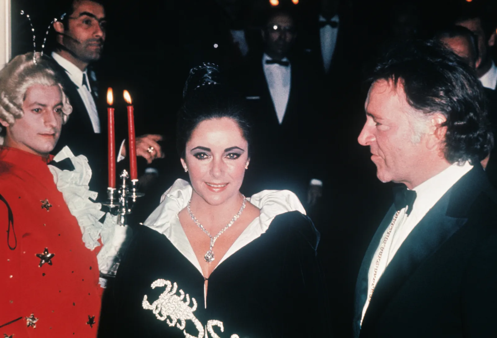 Elizabeth Taylor wears the Scorpio cape and a dazzling million dollar Cariet diamond to Princess Graces birthday party.