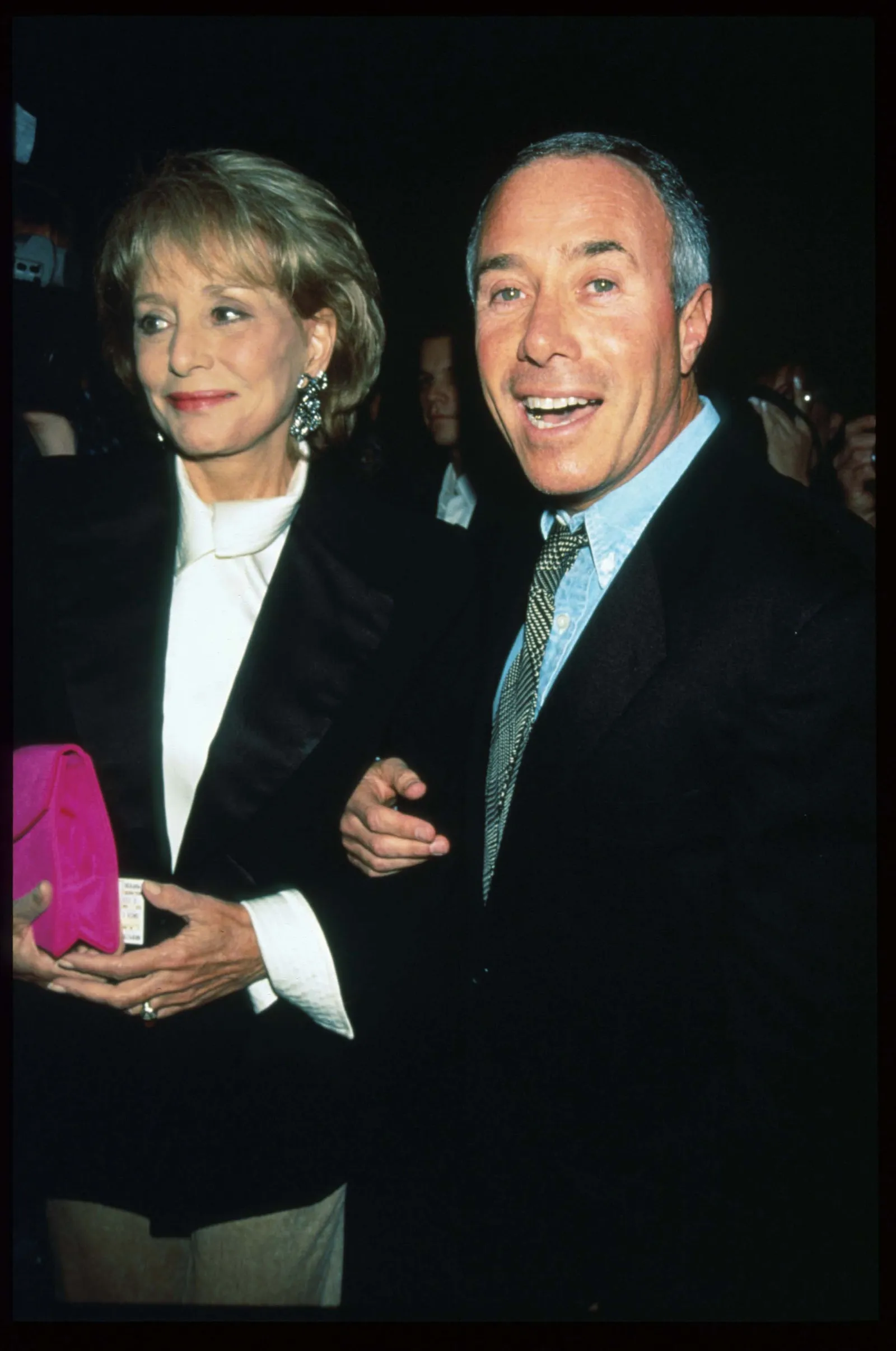 Image may contain David Geffen Barbara Walters Blazer Clothing Coat Jacket Formal Wear Suit Face Head and Person